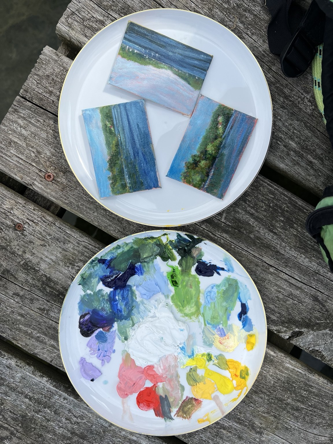 Small paintings and a colorful mixing palette
